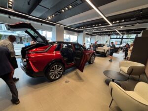 Club members pour over the new Cadillac Lyric at Caddy Dealership in 'K Road' Auckland