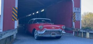 NY CT CLC Driving Tour USA red 57 coming out of covered bridge