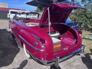 Wed 8th Gudie and Chris' place 49 Chrysler New Yorker convertible is outside w boot open and picnic basket and blanket